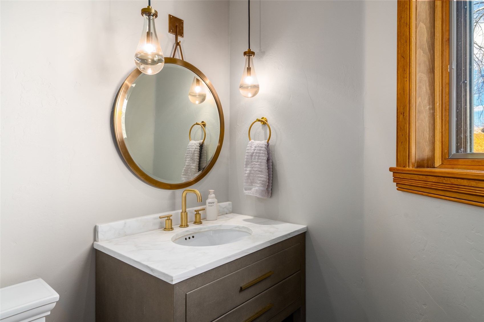 35415 Priest Creek Road Steamboat Springs, CO 80487 - Photo 30 of 50 a bathroom with a sink and a mirror