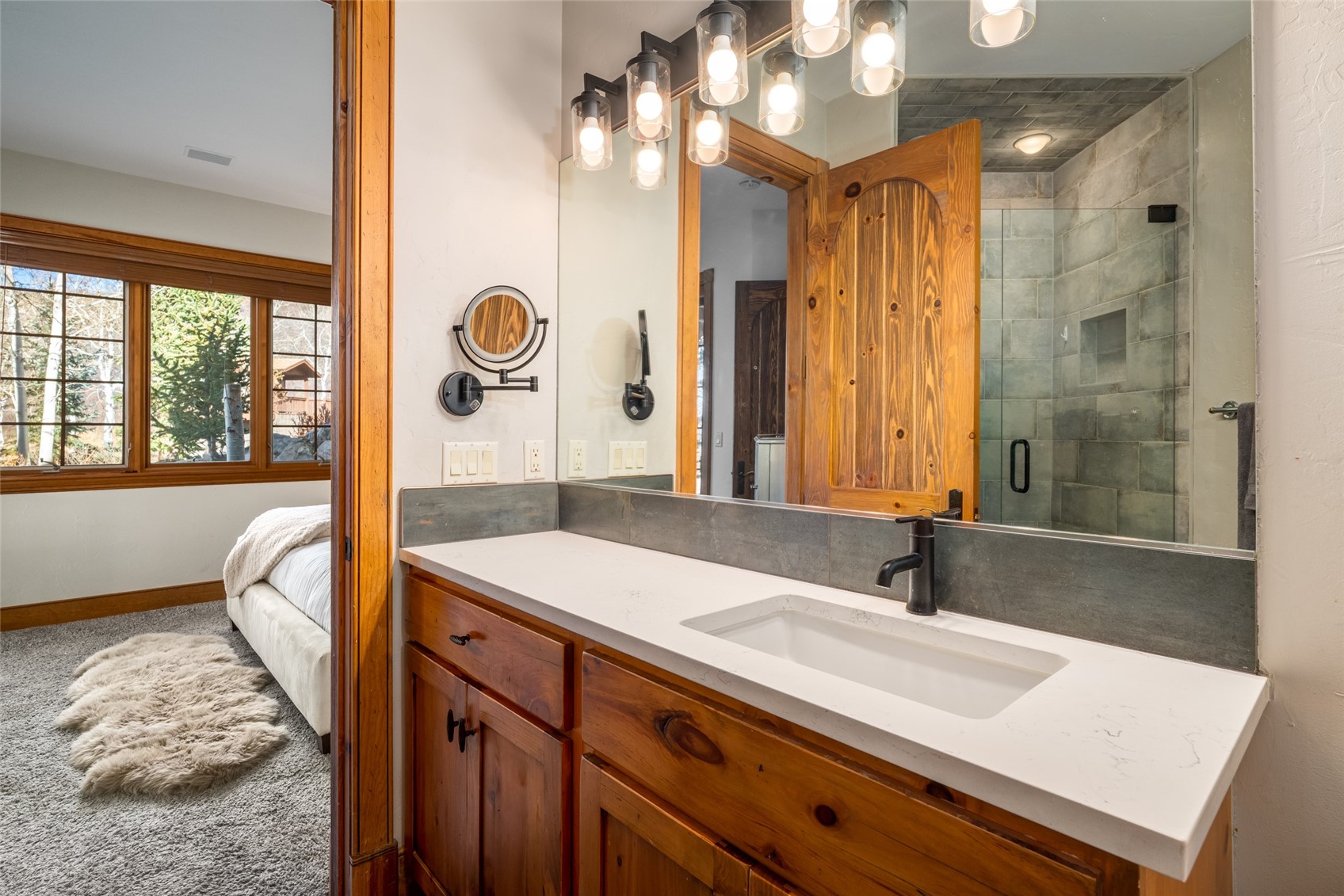 35415 Priest Creek Road Steamboat Springs, CO 80487 - Photo 34 of 50 a bathroom with a sink and a mirror