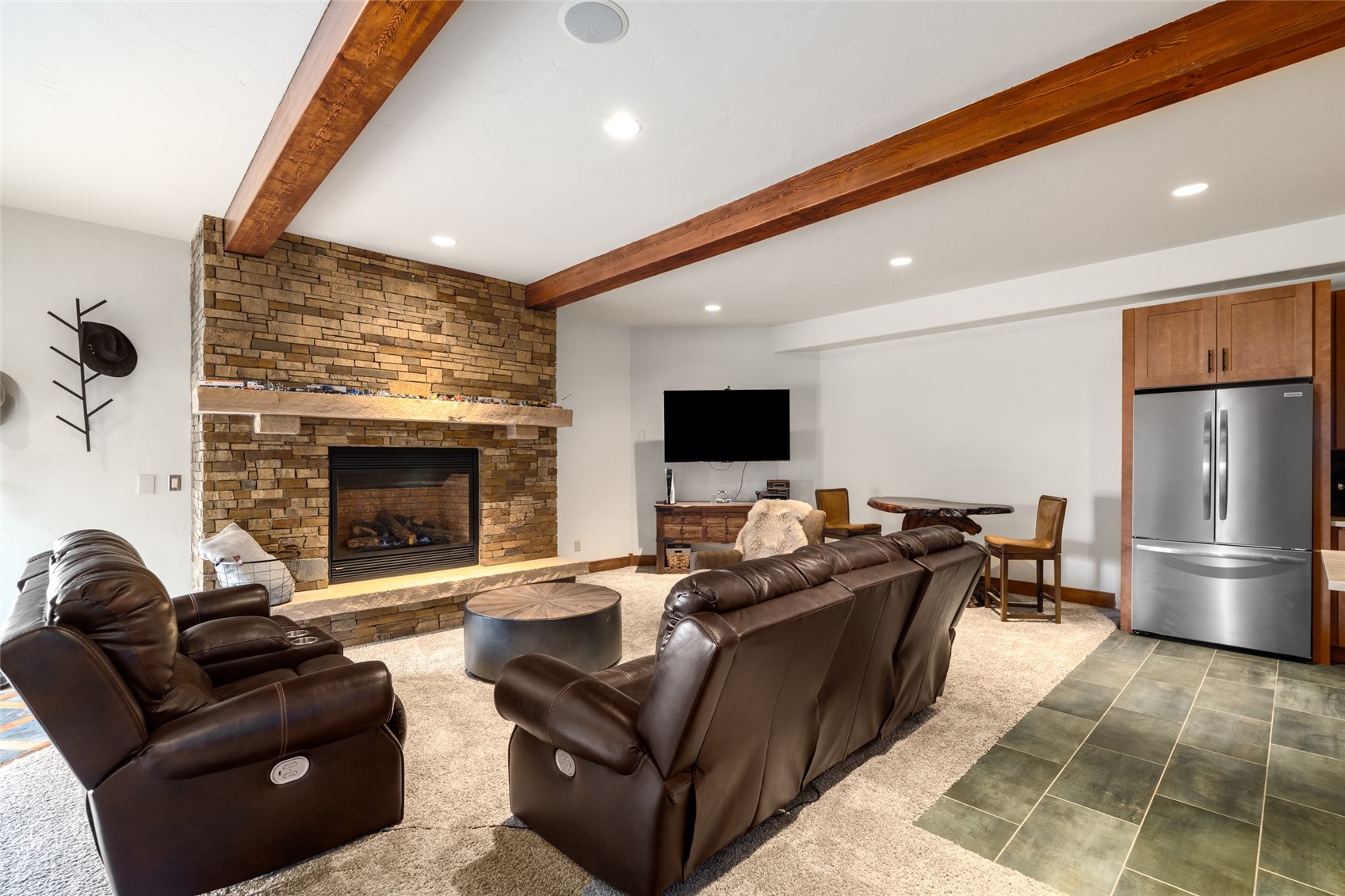 35415 Priest Creek Road Steamboat Springs, CO 80487 - Photo 41 of 50 a living room with furniture and a fireplace