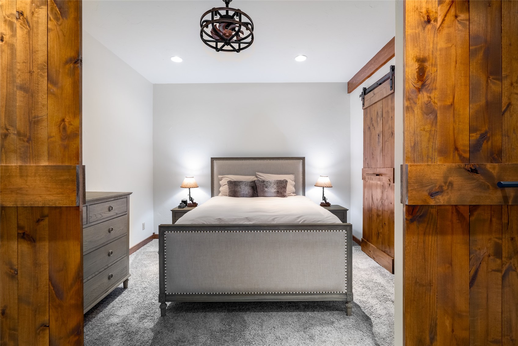 35415 Priest Creek Road Steamboat Springs, CO 80487 - Photo 42 of 50 a bedroom with a bed and a table in it