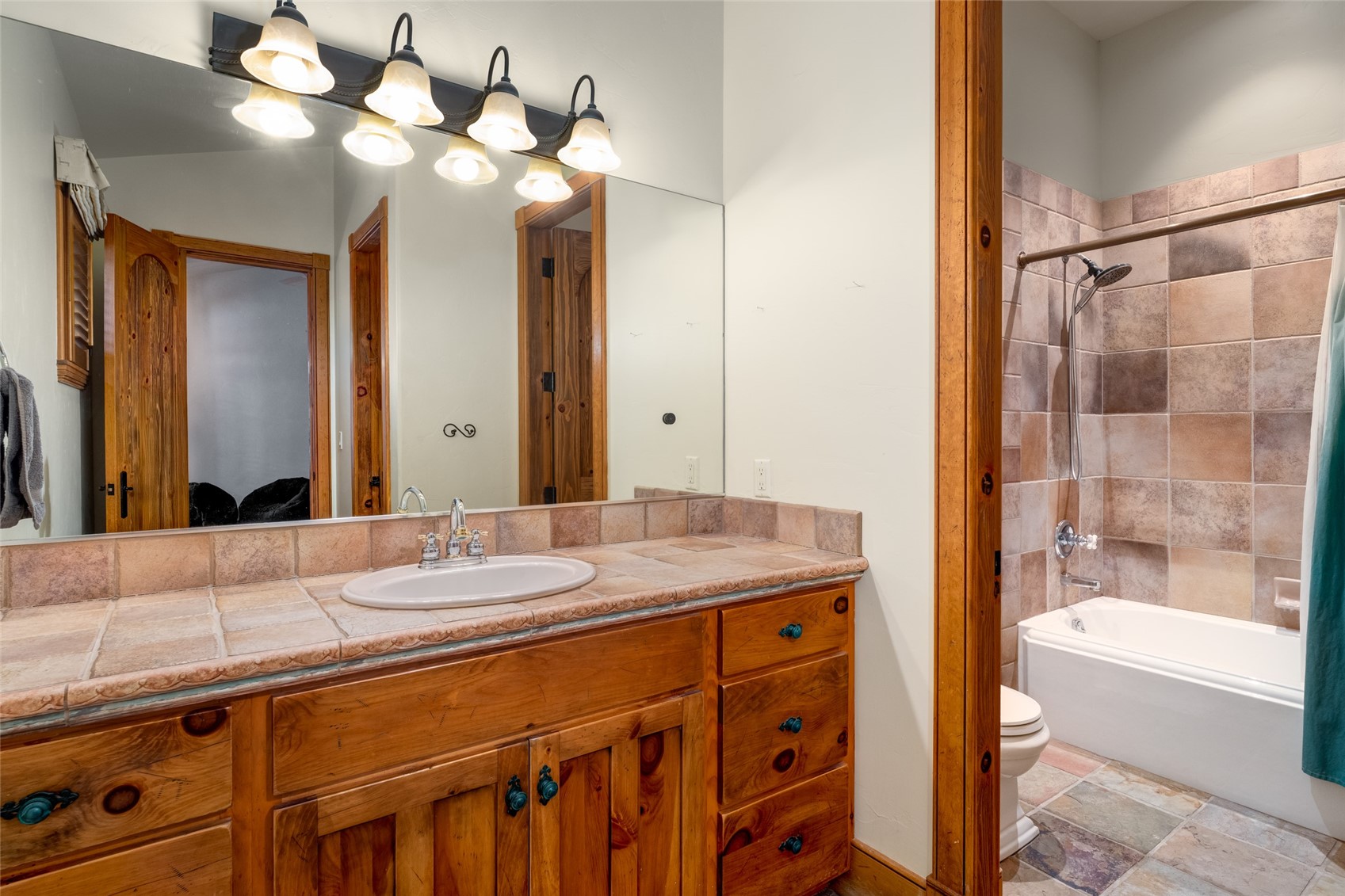 35415 Priest Creek Road Steamboat Springs, CO 80487 - Photo 47 of 50 a bathroom with a sink a vanity and a mirror