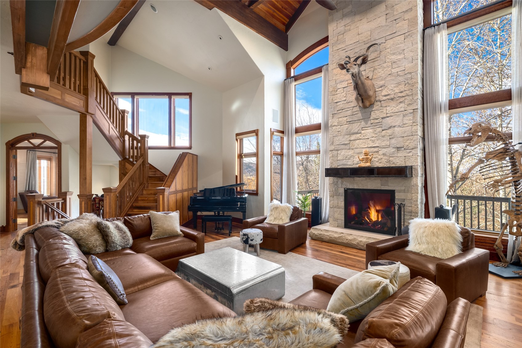 35415 Priest Creek Road Steamboat Springs, CO 80487 - Photo 6 of 50 a living room with furniture fireplace and a large window