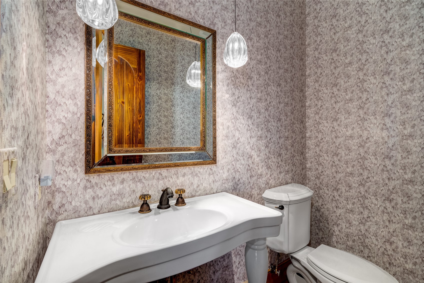 35415 Priest Creek Road Steamboat Springs, CO 80487 - Photo 9 of 50 a bathroom with a sink a toilet and mirror