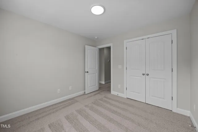 a bathroom with a sink toilet vanity and shower