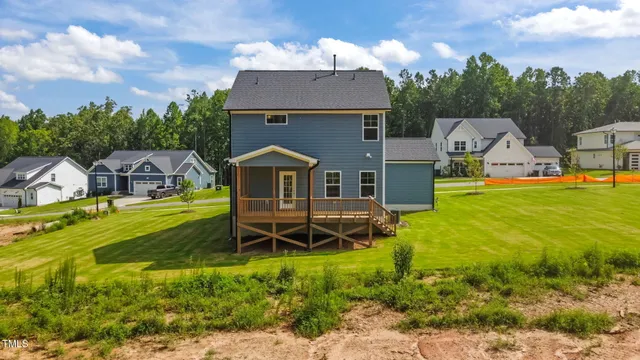 a view of house with swimming pool
