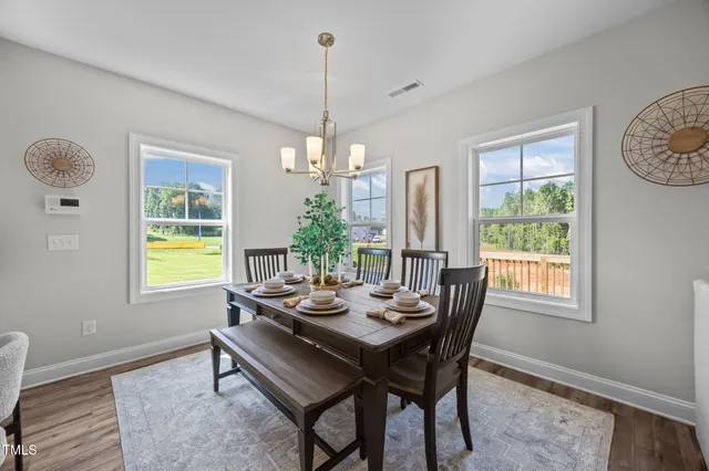 a very nice looking dining room with a table or chairs and a couch