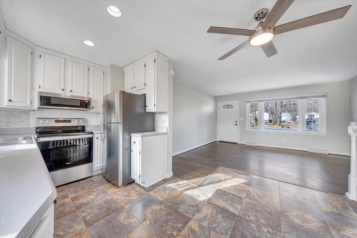 3804 Meadowlark Road Roanoke, VA 24018 - Photo 11 of 54 a kitchen with stainless steel appliances a refrigerator and a stove top oven