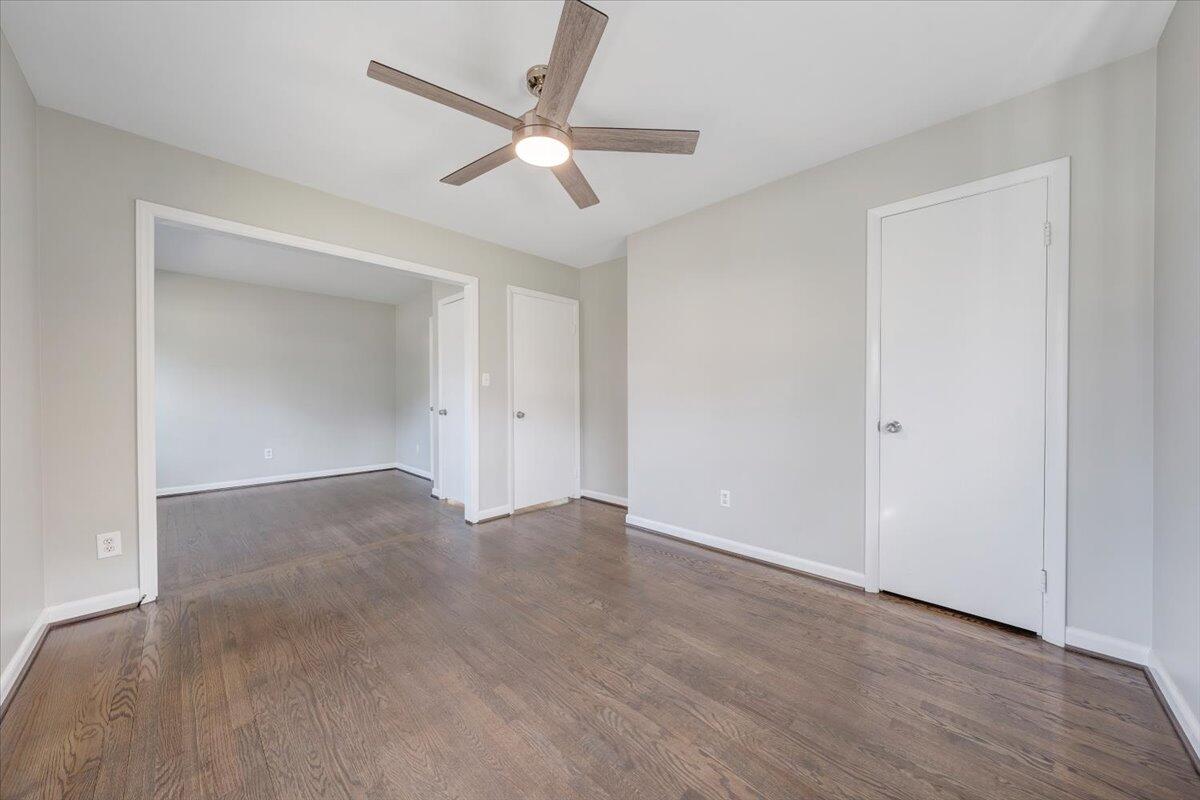 3804 Meadowlark Road Roanoke, VA 24018 - Photo 14 of 54 an empty room with wooden floor and ceiling fan