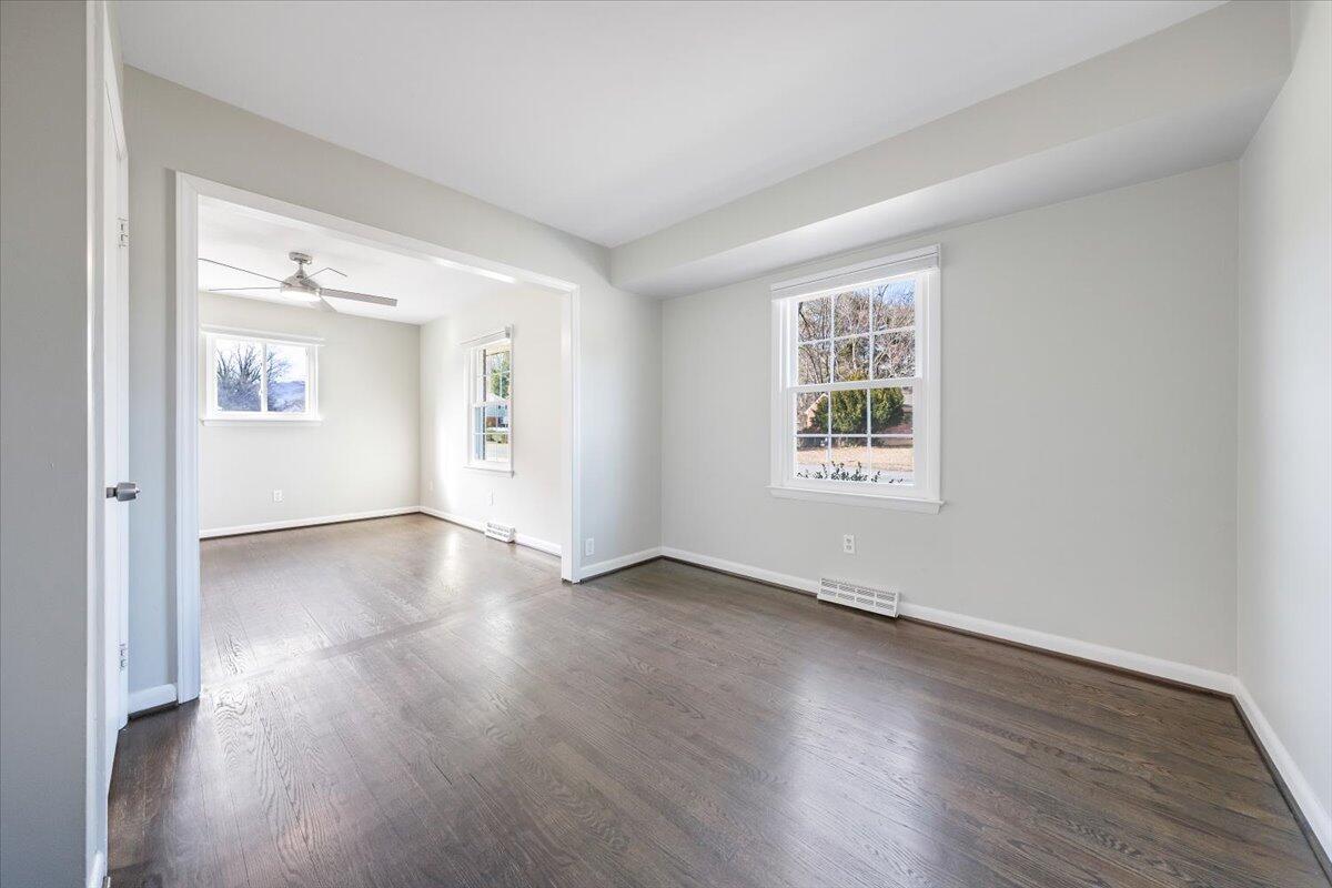3804 Meadowlark Road Roanoke, VA 24018 - Photo 15 of 54 an empty room with wooden floor and windows
