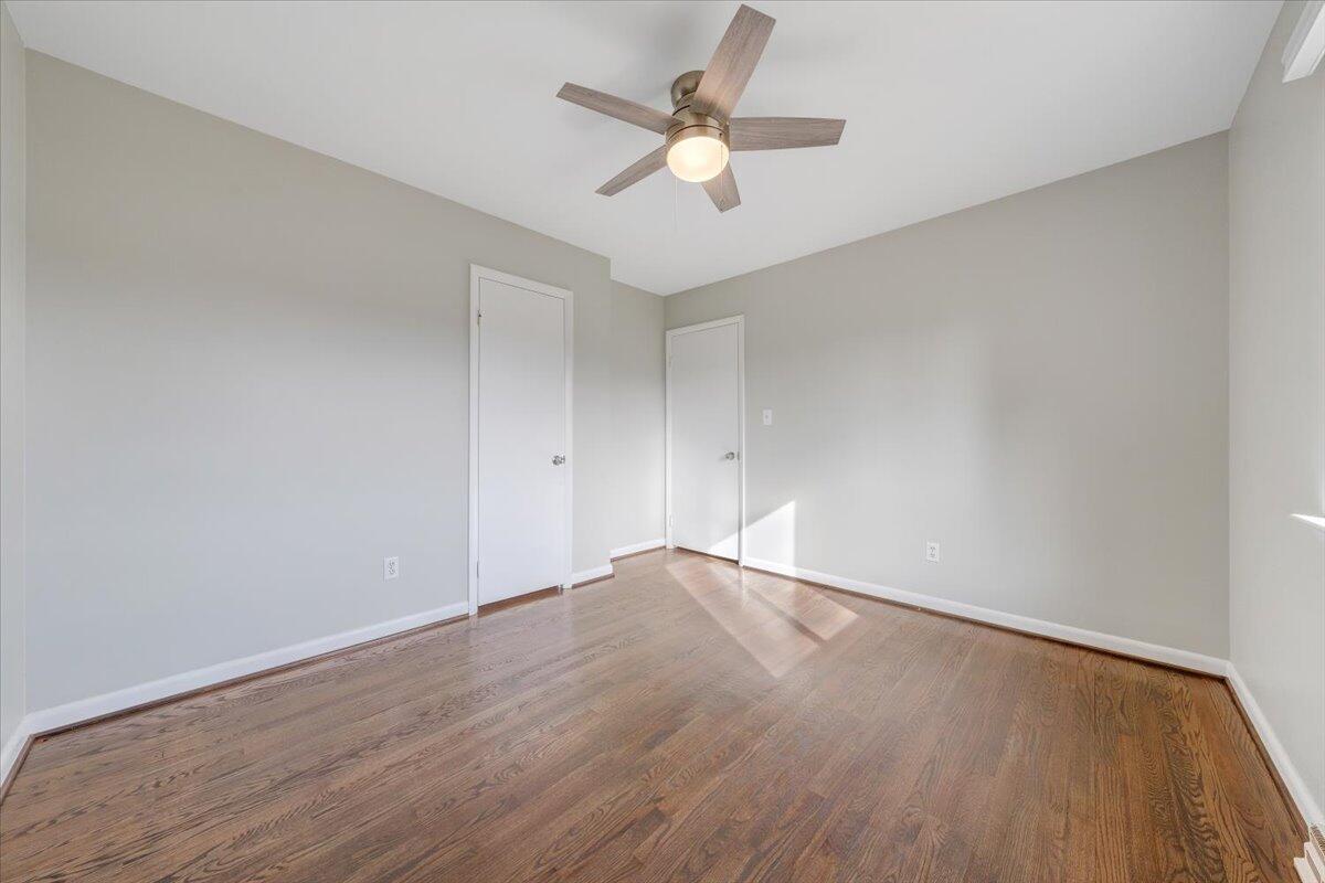 3804 Meadowlark Road Roanoke, VA 24018 - Photo 22 of 54 an empty room with wooden floor and ceiling fan