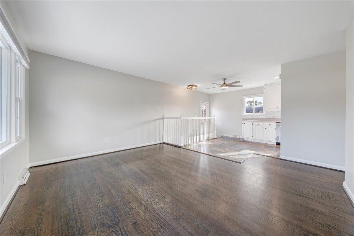 3804 Meadowlark Road Roanoke, VA 24018 - Photo 3 of 54 an empty room with wooden floor kitchen view and windows