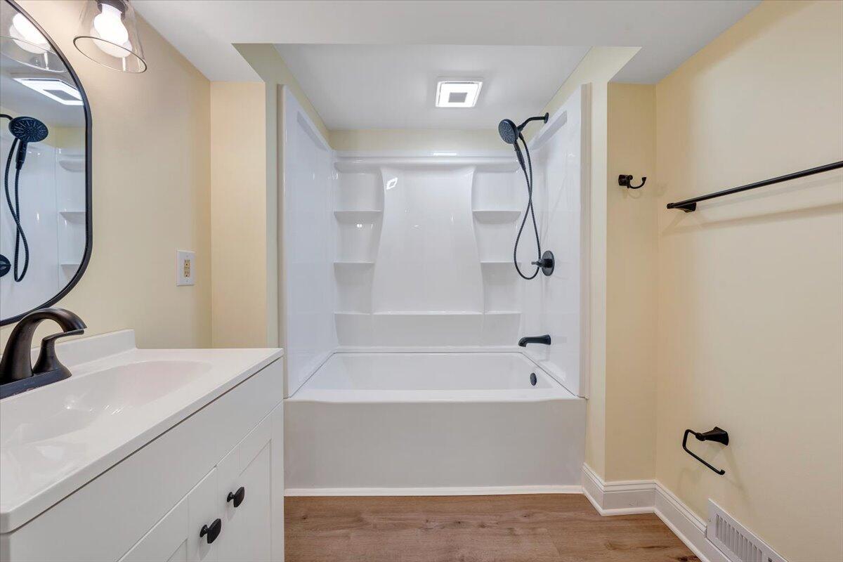 3804 Meadowlark Road Roanoke, VA 24018 - Photo 31 of 54 a bathroom with a sink and a mirror