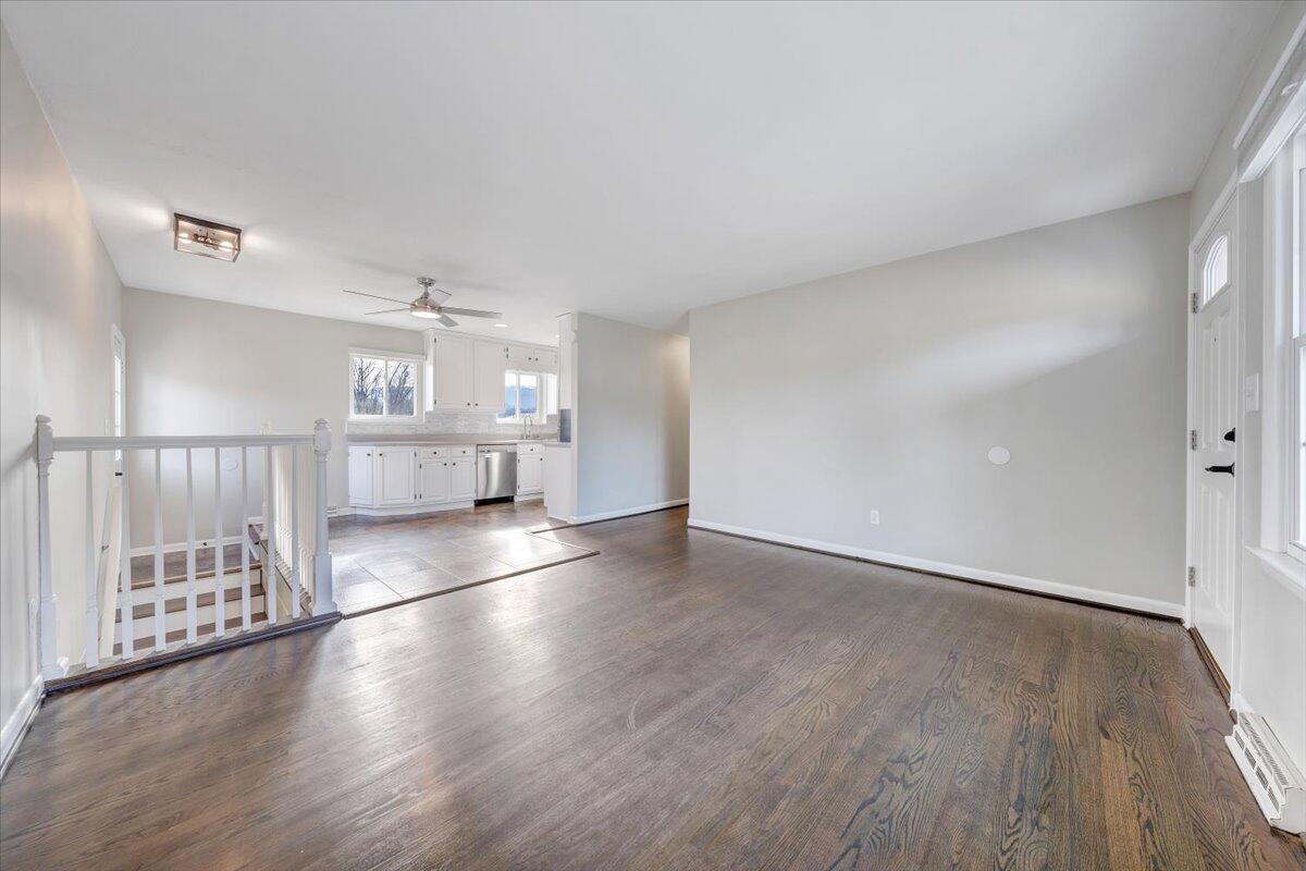 3804 Meadowlark Road Roanoke, VA 24018 - Photo 4 of 54 an empty room with wooden floor and windows