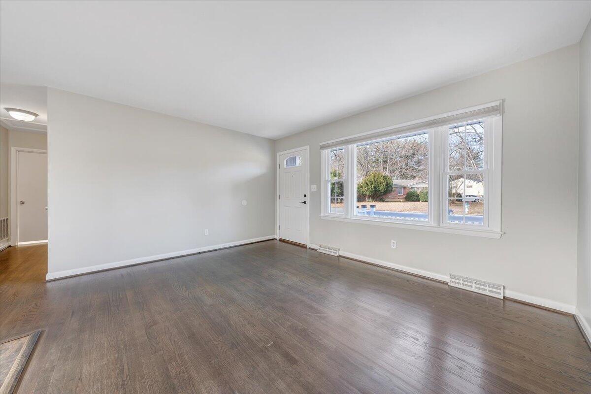 3804 Meadowlark Road Roanoke, VA 24018 - Photo 5 of 54 an empty room with wooden floor and windows