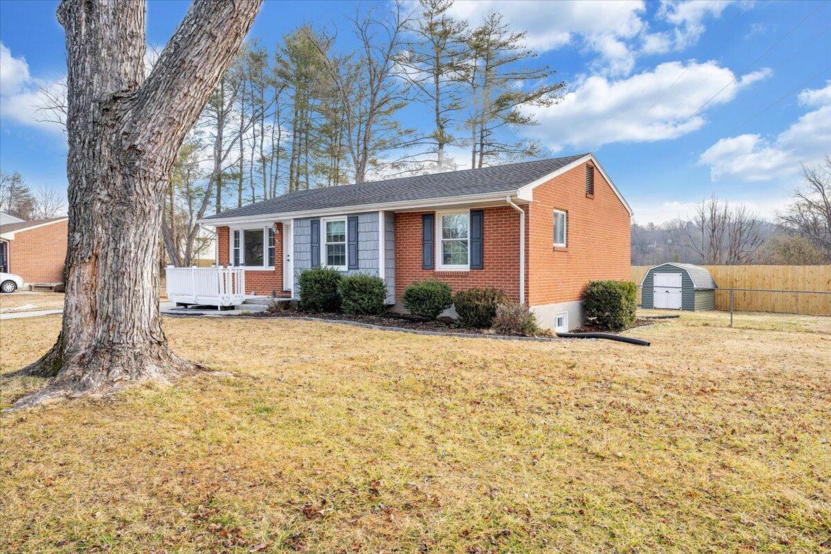 3804 Meadowlark Road Roanoke, VA 24018 - Photo 52 of 54 a front view of a house with a yard and garage