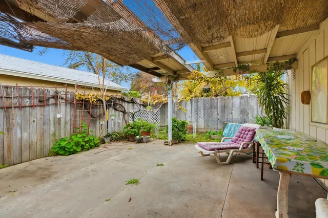 a view of yard with patio