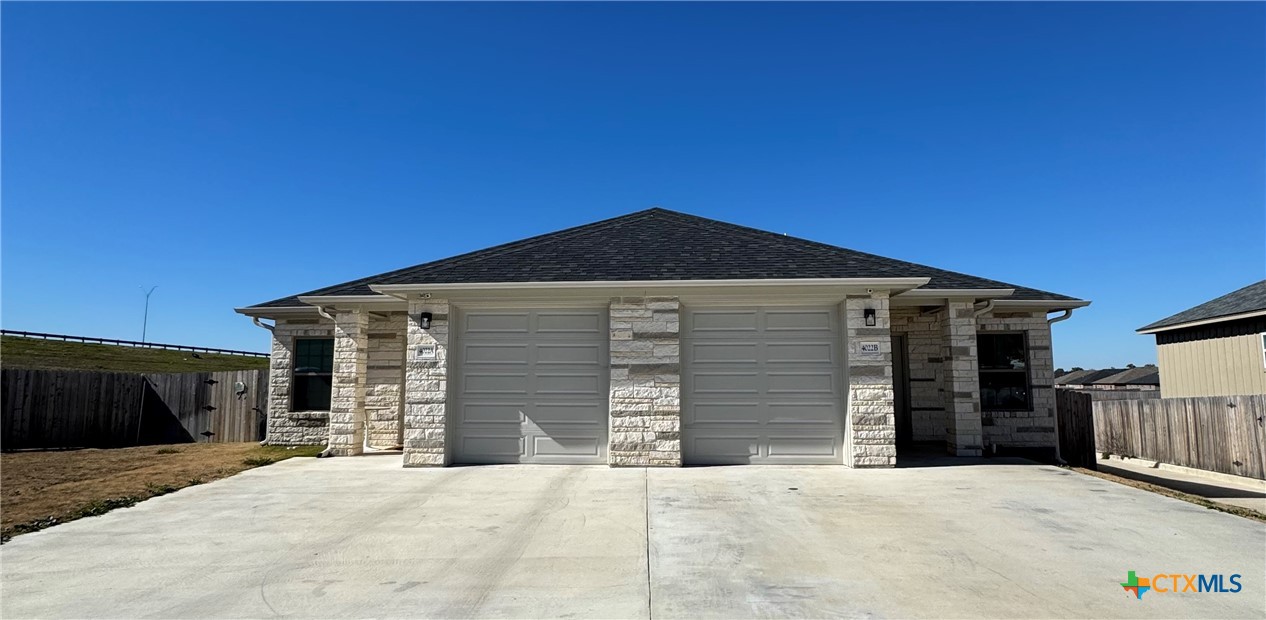 4022 Keller Road, Unit B Temple, TX 76504 - Photo 1 of 34 a front view of a house with a garage