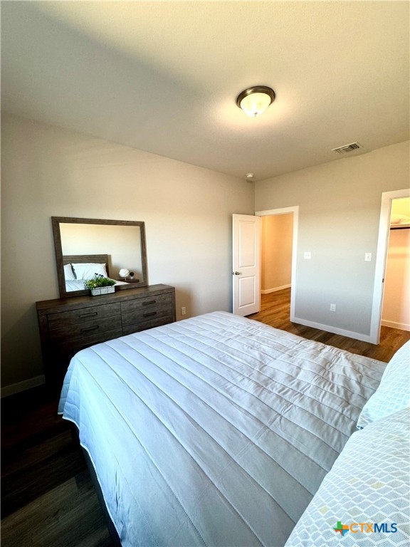 4022 Keller Road, Unit B Temple, TX 76504 - Photo 26 of 34 a bedroom with a bed and a mirror