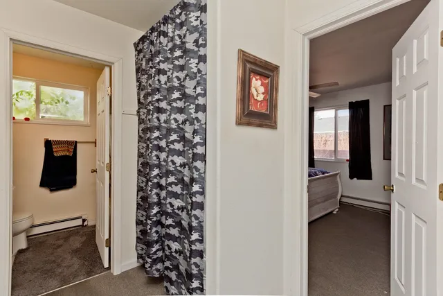 workspace with wooden floor windows and cabinet