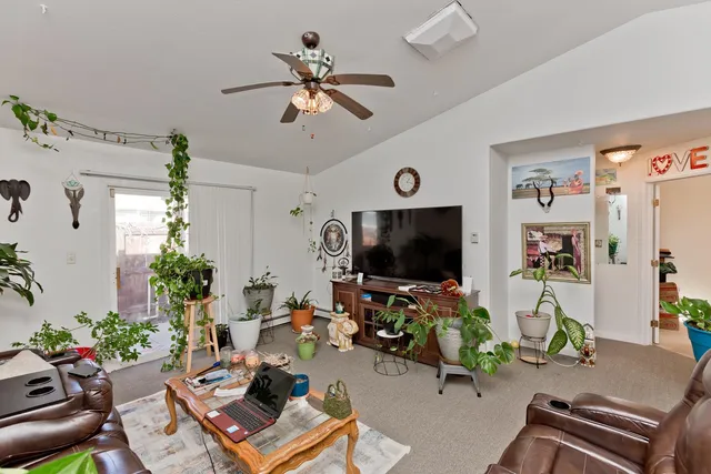 a room with furniture and a flat screen tv
