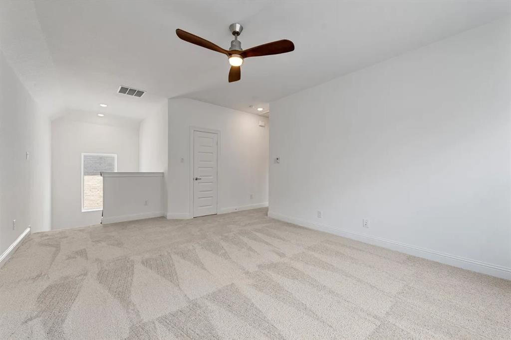 9337 Loggerhead Way Fort Worth, TX 76118 - Photo 31 of 40 an empty room with ceiling fan and window