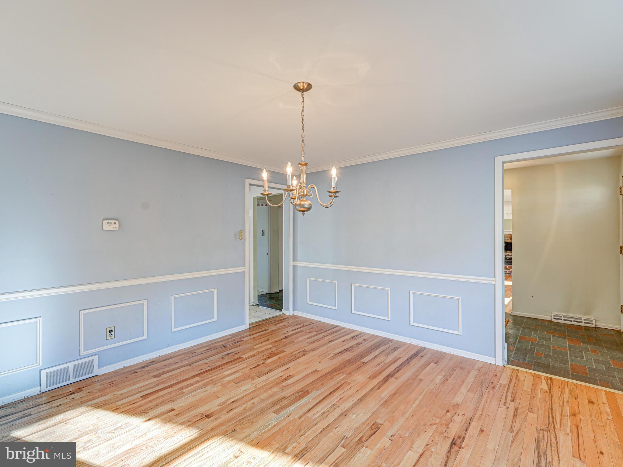 504 Crestview Road Wayne, PA 19087 - Photo 22 of 56 a bedroom with a bed and a chandelier