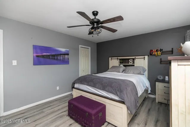 a bedroom with bed and a chandelier