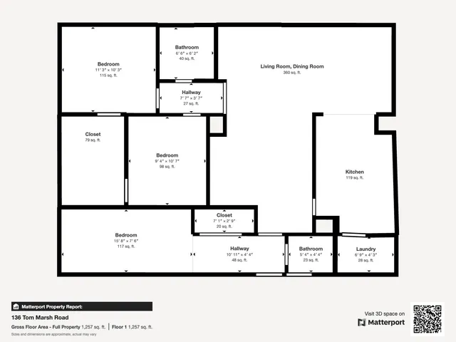 a view of a field with trees in the background
