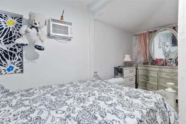 a bedroom with a bed and cabinets