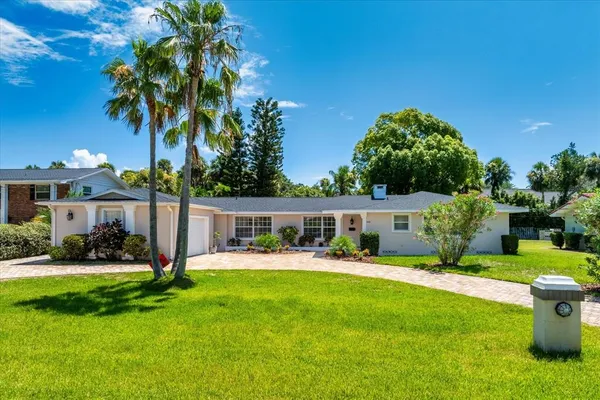 a view of a house with a yard porch and sitting area