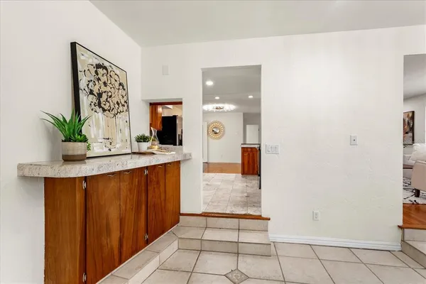 a large bathroom with a sink a mirror and a shower