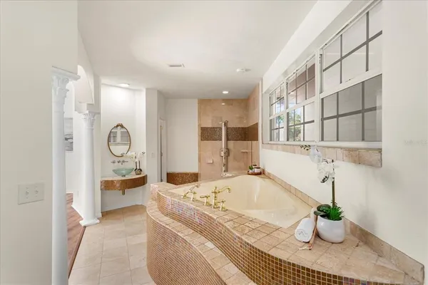 a kitchen with a sink and a stove top oven