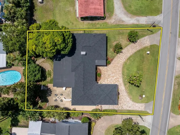 an aerial view of a house with a garden