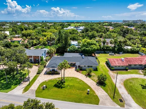 a view of a swimming pool with a yard