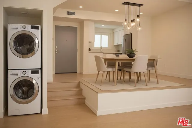a view of a dining room with furniture and a chandelier