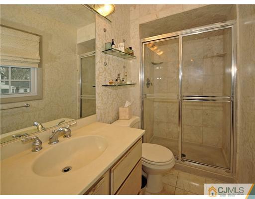 7 Edgewood Road Old Bridge, NJ 07747 - Photo 9 of 16 a bathroom with a sink toilet and shower