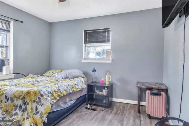 a bedroom with a bed and a table in it