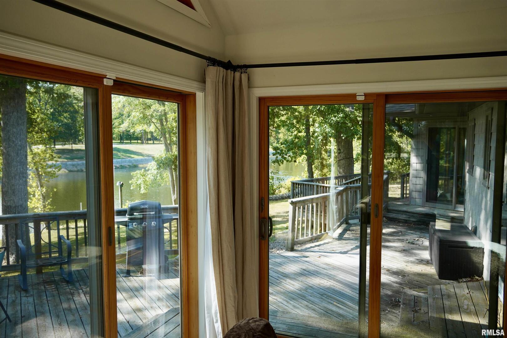 15316 Lake Point Drive Benton, IL 62812 - Photo 22 of 58 a view of a room with wooden floor and outdoor view