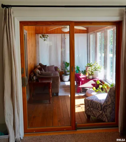 a utility room with dryer washer and a view of kitchen