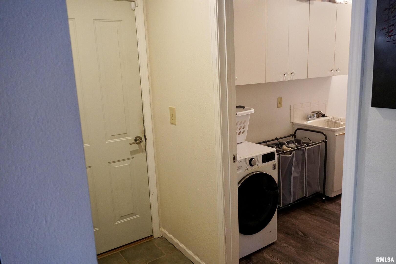 15316 Lake Point Drive Benton, IL 62812 - Photo 32 of 58 a utility room with dryer washer and a view of kitchen