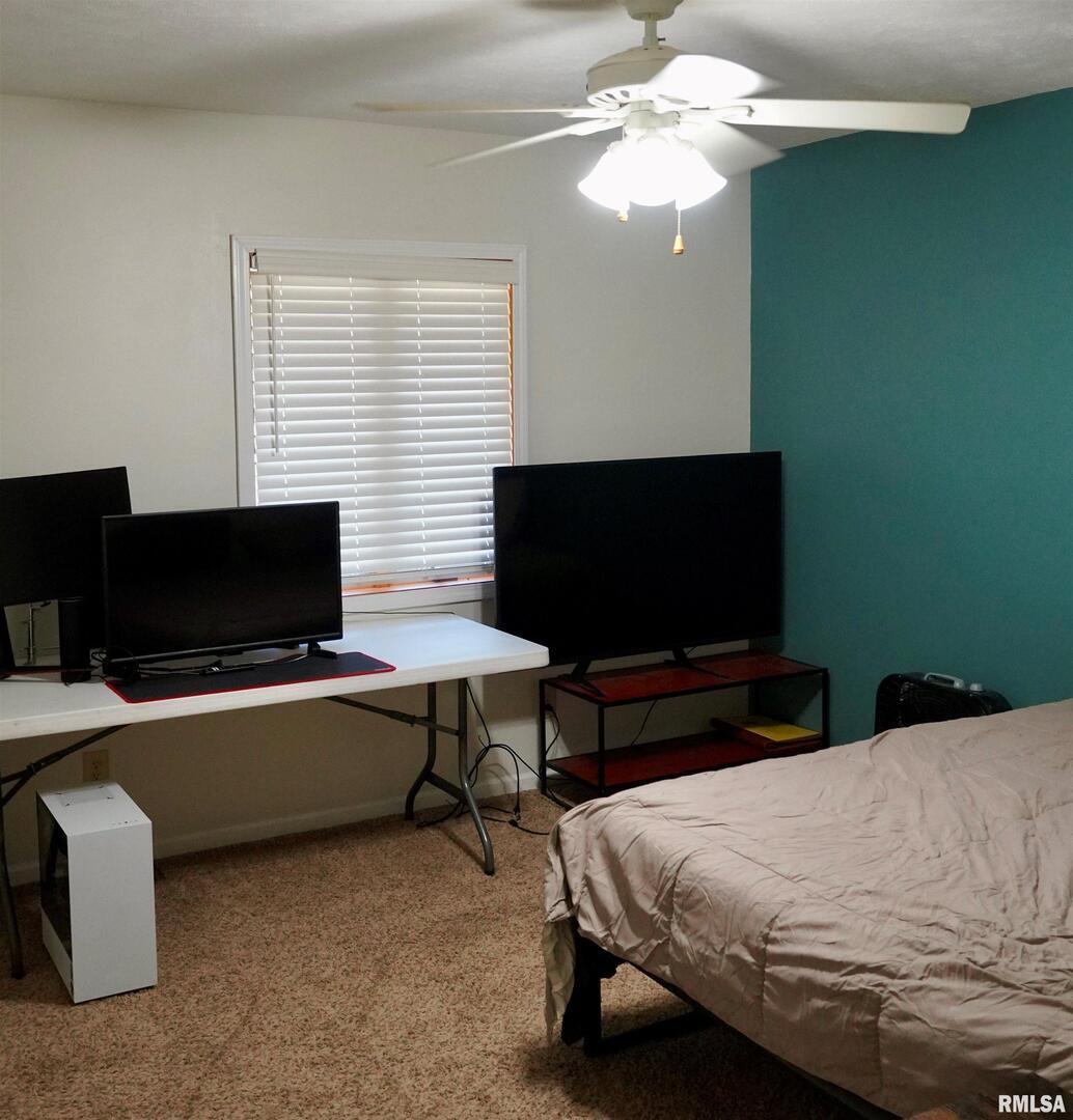 15316 Lake Point Drive Benton, IL 62812 - Photo 39 of 58 a bedroom with a bed and a flat screen tv