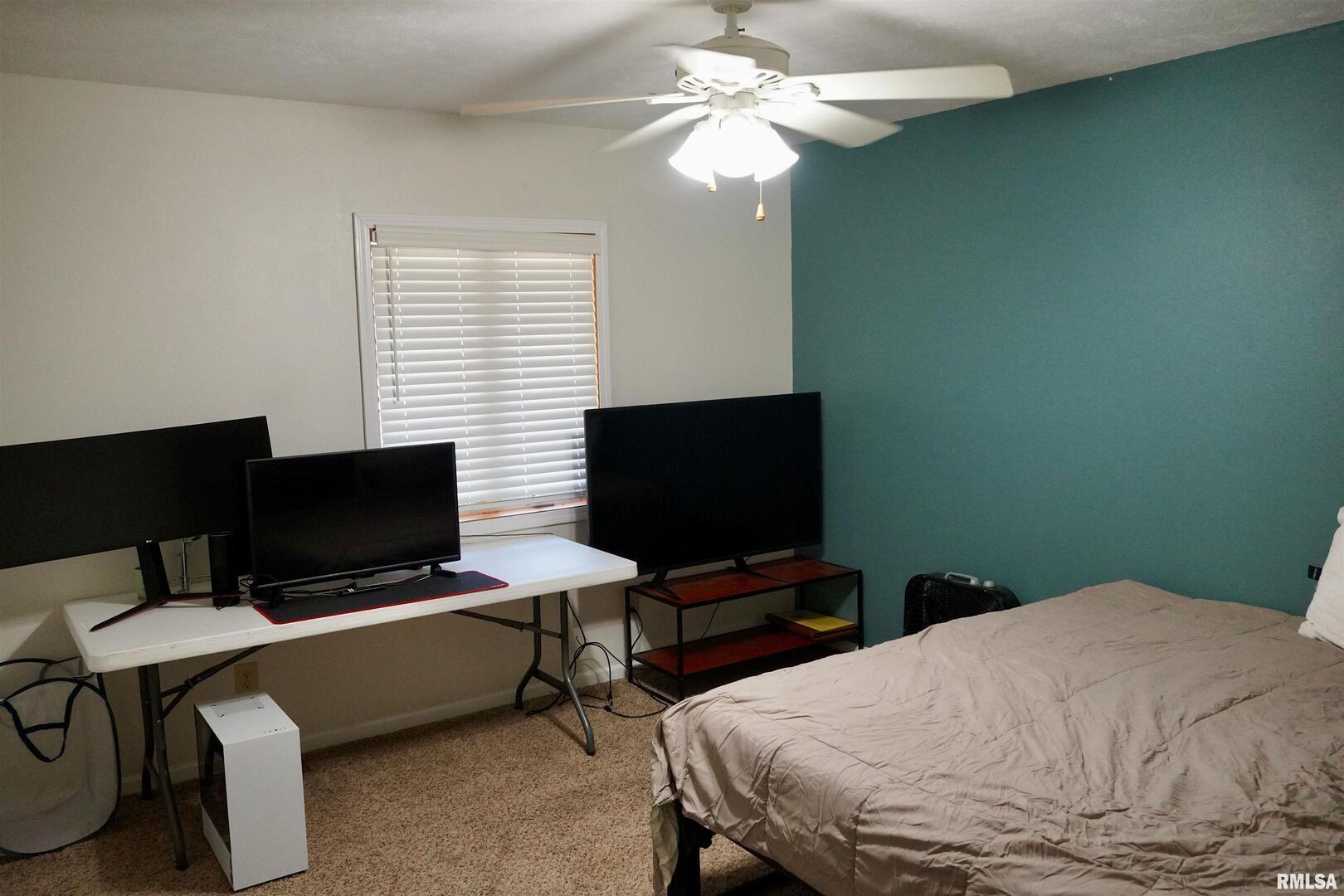 15316 Lake Point Drive Benton, IL 62812 - Photo 40 of 58 a bedroom with a bed and a flat screen tv