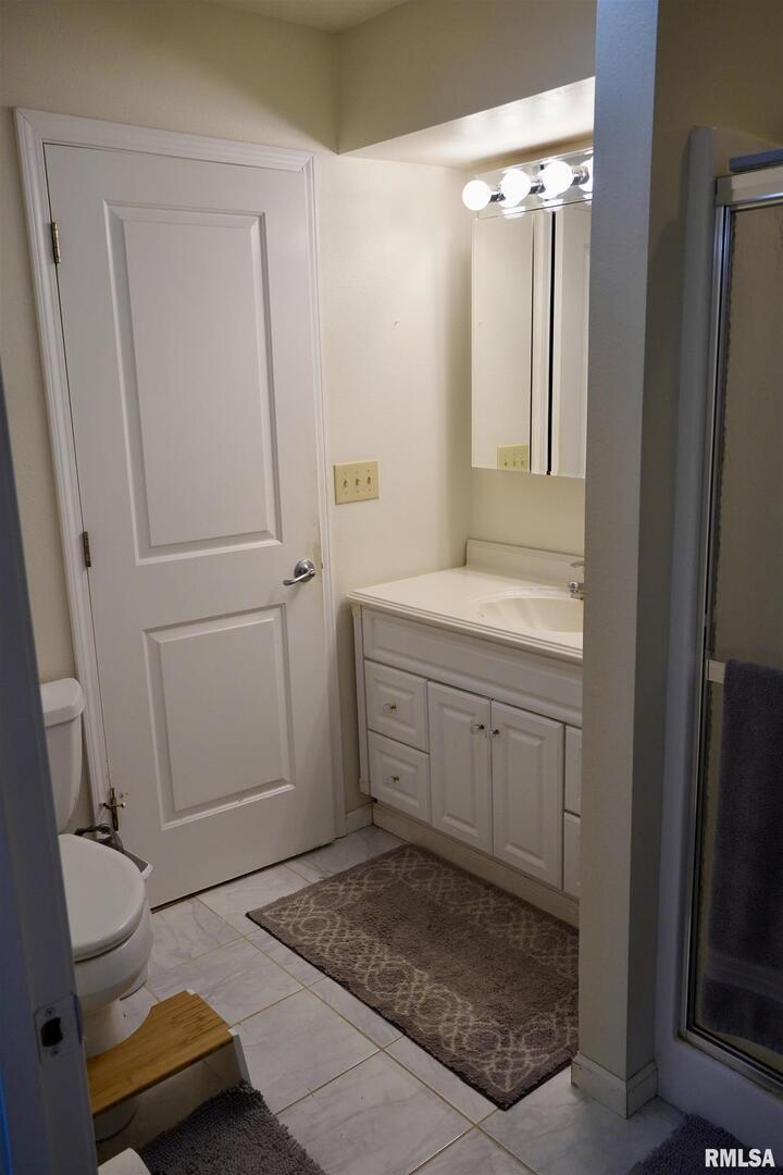 15316 Lake Point Drive Benton, IL 62812 - Photo 41 of 58 a bathroom with a sink and mirror with toilet