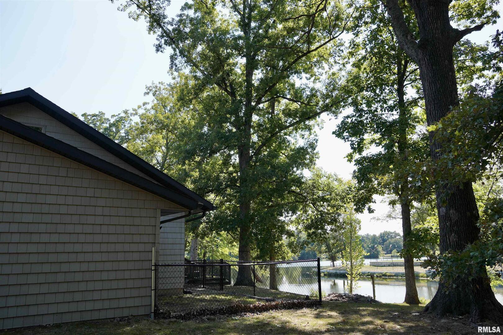 15316 Lake Point Drive Benton, IL 62812 - Photo 8 of 58 a front view of a house with trees