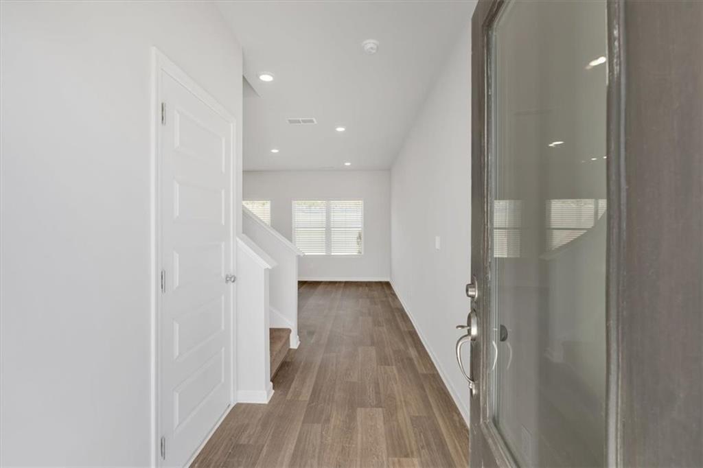 117 Lavender Circle Calhoun, GA 30701 - Photo 2 of 22 a view of a hallway with wooden floor