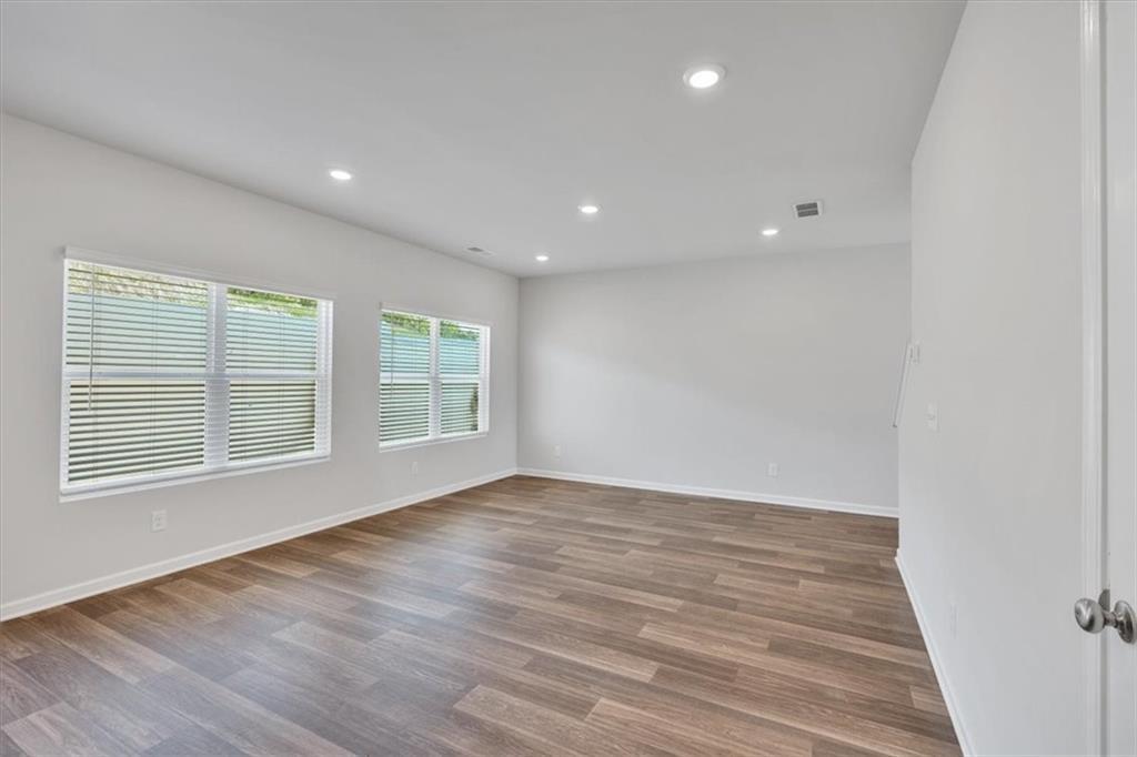 117 Lavender Circle Calhoun, GA 30701 - Photo 3 of 22 a view of an empty room with wooden floor and a window