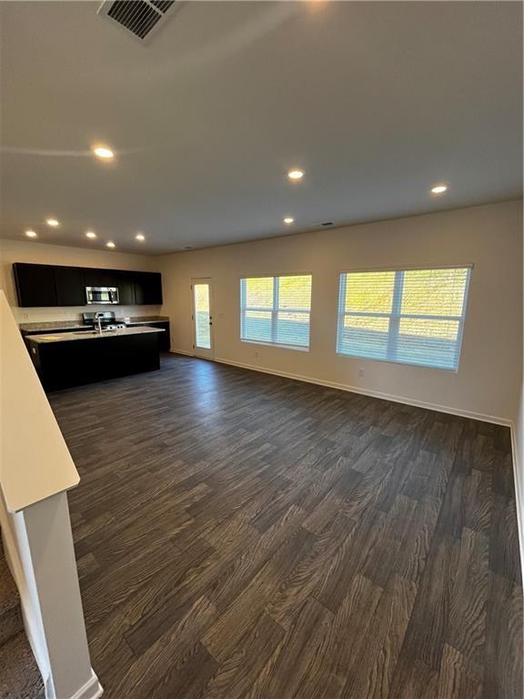 117 Lavender Circle Calhoun, GA 30701 - Photo 4 of 22 an empty room with wooden floor and windows