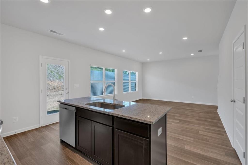 117 Lavender Circle Calhoun, GA 30701 - Photo 5 of 22 a view of kitchen island a sink wooden floor and kitchen living room