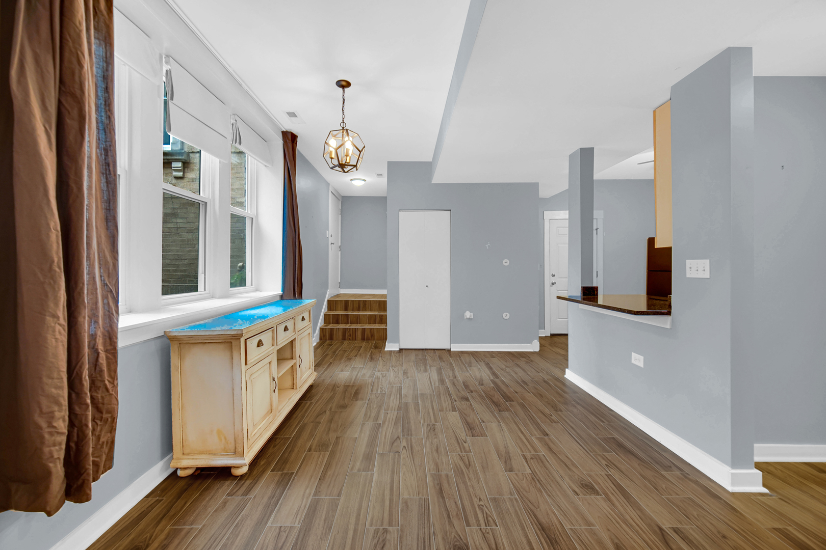 4343 North Sacramento Avenue, Unit AG Chicago, IL 60618 - Photo 11 of 27 a view of a hallway with wooden floor and staircase