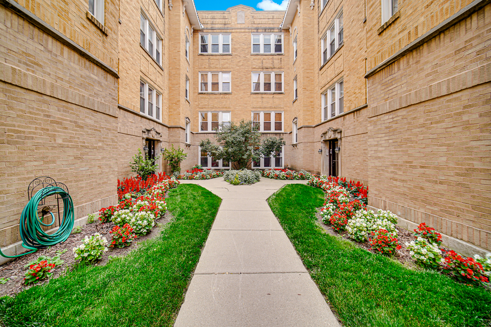 4343 North Sacramento Avenue, Unit AG Chicago, IL 60618 - Photo 2 of 27 a view of street with flower on the wall
